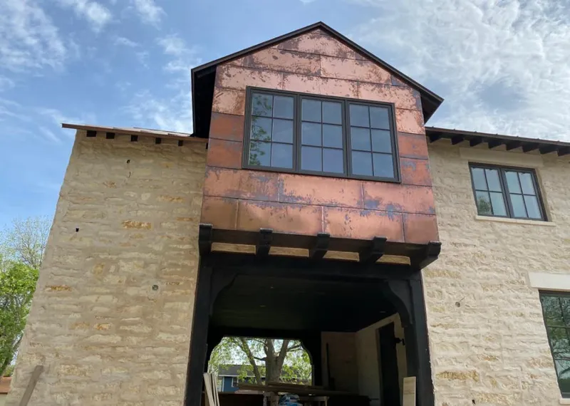 Copper metal panel facade on a stone building for Roof Repair in Cortlandt
